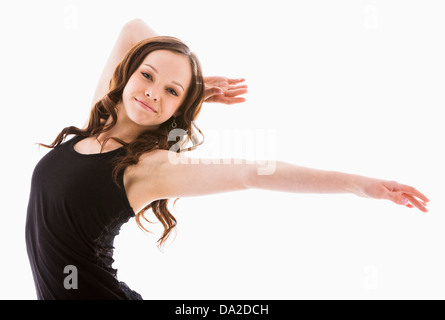 Portrait of girl (12-13) with arms outstretched Stock Photo