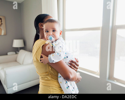 USA, Utah, Lehi, Woman holding her son (3 months) Stock Photo