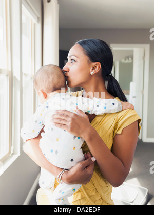 USA, Utah, Lehi, Woman holding her baby son (3 months) Stock Photo