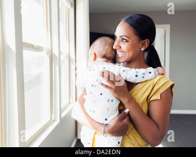 USA, Utah, Lehi, Woman holding her baby son (3 months) Stock Photo