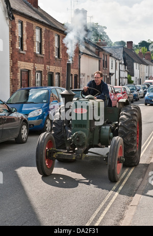 An old Marshall tractor leaving the annual vintage vehicle rally jn Presteigne, Powys, UK. This is a Type M tractor from about 1942 Stock Photo