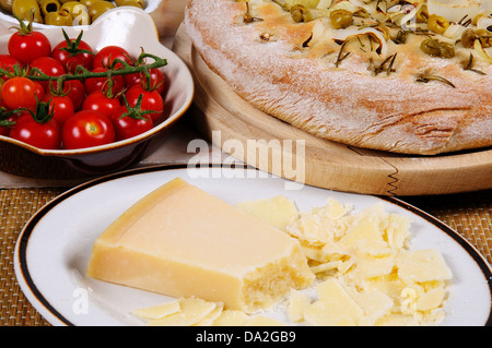 Italian green olive, onion and rosemary Focaccia with cherry tomatoes, olives and Parmessan cheese. Stock Photo