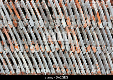 stacked a bunch of old tiles from the roof Stock Photo