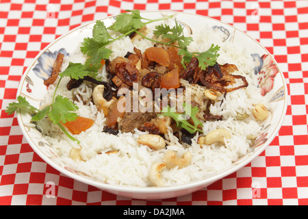 A serving bowl of home-made biryani-type fragrant lamb curry Stock Photo