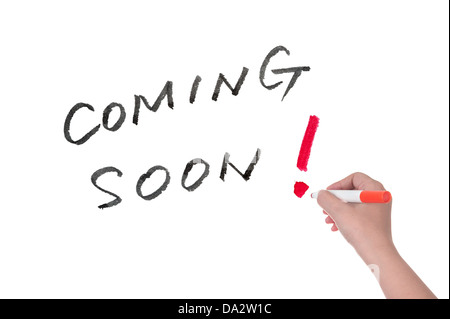 Coming soon words written on white board Stock Photo