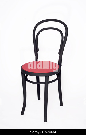 Wood frame chair with red seat. Stock Photo