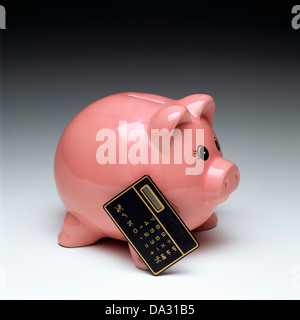 Calculator and grey piggy bank in glasses isolated on white Stock Photo ...