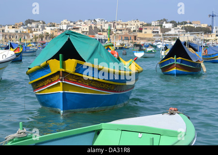 Colourful fishing boats, Marsaxlokk fishing village, Malta. Stock Photo