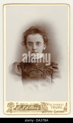 Original Victorian cartes de visite (CDV) portrait of serious young Victorian girl wearing glasses. From the photographic studio of E.J. Ellery, Truro, Cornwall, England, U.K. circa 1898 Stock Photo