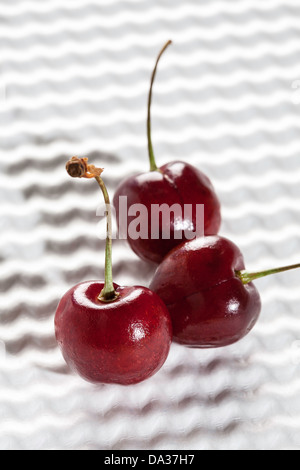 Three Cherries on White Background Stock Photo