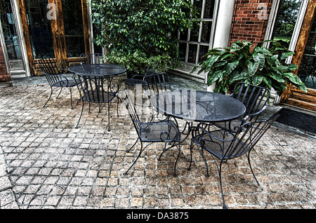 This image is wrought iron table and chairs on the patio at the Alabama Shakespeare Festival in Montgomery, Alabama. Stock Photo