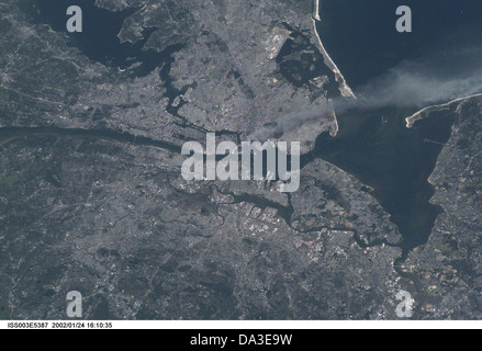 New York City September 11, 2001 Visible from space smoke plume rises from Manhattan area after two planes crashed into towers Stock Photo