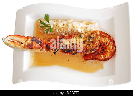 Grilled lobster tail served in a sauce, isolated on white background Stock Photo