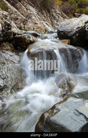 Tiny waterfall in mountain stream, Allt na Dunaiche, Isle of Skye, Scotland,UK Stock Photo