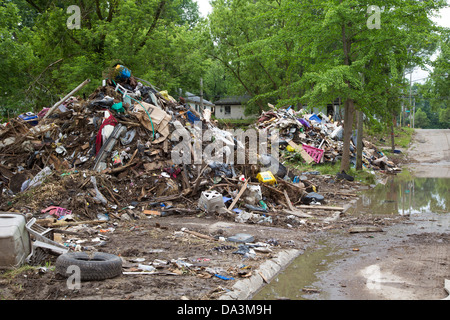 Piles of trash await disposal as the Detroit Blight Authority cleans up 14 blocks of the Brightmoor neighborhood. Stock Photo