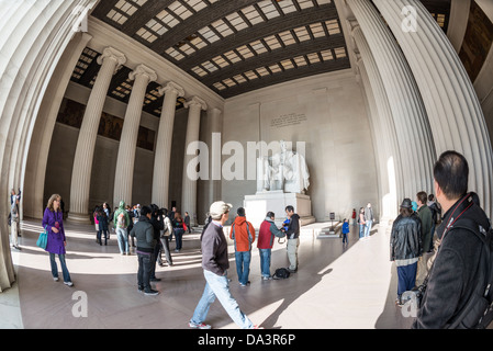 WASHINGTON DC, USA - Tourists visit the statue of Abraham Lincoln at the Lincoln Memorial in Washington DC. Wide-angle fisheye lens. Stock Photo