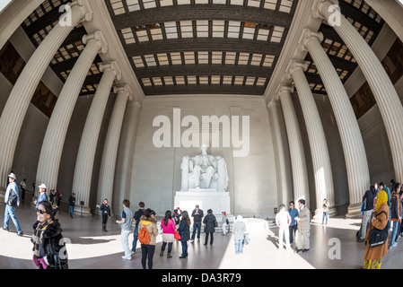 WASHINGTON DC, USA - Tourists visit the statue of Abraham Lincoln at the Lincoln Memorial in Washington DC. Wide-angle fisheye lens. Stock Photo