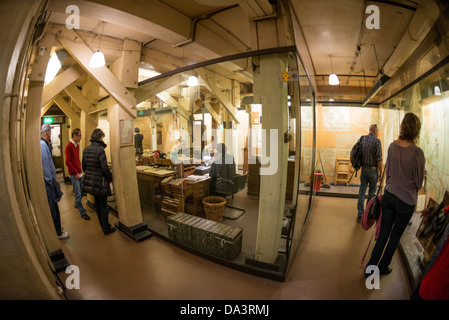 LONDON, UK - A wide-angle shot of the Map Room at the Churchill War Rooms in London. The museum, one of five branches of the Imerial War Museums, preserves the World War II underground command bunker used by British Prime Minister Winston Churchill. Its cramped quarters were constructed from a converting a storage basement in the Treasury Building in Whitehall, London. Being underground, and under an unusually sturdy building, the Cabinet War Rooms were afforded some protection from the bombs falling above during the Blitz. Stock Photo