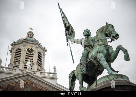BRUSSELS, Belgium - A statue of Godfrey of Bouillon, leader of the first crusade in 1096 AD, stands in the center of the Place Royale in central Brusses, Belgium. The statue was sculpted by Eugene Simonis in 1848. The statue stands in front of the Church of Saint Jacques-sur-Coudenberg. Stock Photo