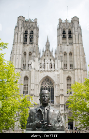 BRUSSELS, Belgium — King Baudouin statue in front of the Cathedral of St. Michael and St. Gudula (in French, Co-Cathédrale collégiale des Ss-Michel et Gudule). A church was founded on this site in the 11th century but the current building dates to the 13th to 15th centuries. The Roman Catholic cathedral is the venue for many state functions such as coronations, royal weddings, and state funerals. It has two patron saints, St Michael and St Gudula, both of whom are also the patron saints of Brussels. Stock Photo