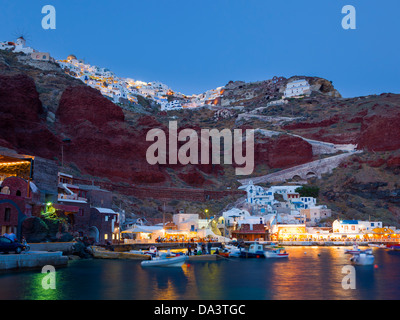 Night shot of Ammoudi Bay with Oia Santorini Greece above. Stock Photo