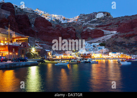 Night shot of Ammoudi Bay with Oia Santorini Greece above. Stock Photo