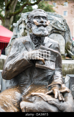 BRUSSELS, Belgium — A commemorative statue honors Karel Buls (Charles Buls), who served as mayor of Brussels from 1881 to 1899. The monument stands in Grasmarkt/Rue du Marché aux Herbes-Agora Square in Brussels' historic Lower Town district. Buls was known for his preservation of Brussels' architectural heritage and urban planning initiatives during the late 19th century. Stock Photo