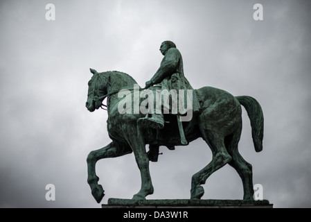 BRUSSELS, Belgium — An equestrian statue commemorates Albert I (1875-1934), King of the Belgians, at the foot of the Mont des Arts. The mounted figure of Albert I, who led Belgium through World War I and earned the nickname 'The Soldier King,' stands across from a statue of his wife, Queen Elisabeth. The monument honors his leadership during World War I and his contributions to Belgian democracy. Stock Photo