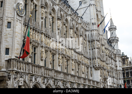 BRUSSELS, Belgium - Detail of the front exterior of the Town Hall (Hotel de Ville) in the Grand Place, Brussels. Originally the city's central market place, the Grand-Place is now a UNESCO World Heritage site. Ornate buildings line the square, including guildhalls, the Brussels Town Hall, and the Breadhouse, and seven cobbelstone streets feed into it. Stock Photo
