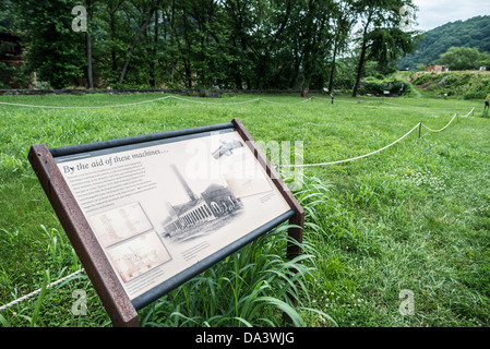 HARPERS FERRY, West Virginia, United States — An interpretive sign at Harpers Ferry National Historical Park explains the archaeological site of the former US Armory and Arsenal. This location, crucial to the town's industrial history and John Brown's 1859 raid, offers visitors insights into 19th-century weapons manufacturing and the events leading to the Civil War. Stock Photo