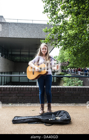 Blind busker playing a guitar, South Bank, London, England, UK. Stock Photo