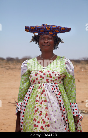 Herero woman in traditional dress, near Uis, Namibia, Africa Stock Photo