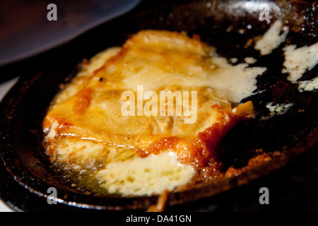 A waiter hold a Flaming Greek Cheese at Pegasus restaurant in the Detroit district of Greektown Stock Photo