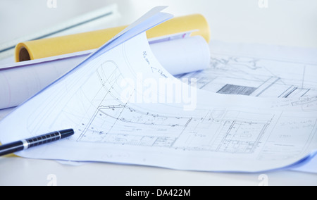 Different architectural drawings with pen on desk in office Stock Photo