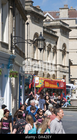 Red open top double decker tour bus and tourists Bath, Somerset, England Stock Photo