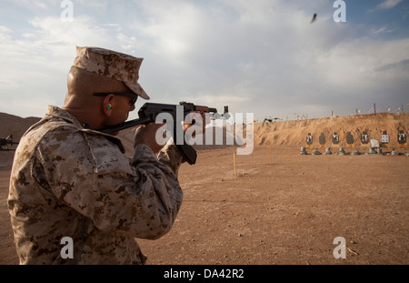 U.S. Marine Corps Chief Warrant Officer 4 Rodney Emery, ordnance officer, Regimental Combat Team 7 engages his target during a foreign weapons and NATO ballistics live-fire shoot on Camp Leatherneck, Helmand province, Afghanistan, July 1, 2013. The Marine Stock Photo