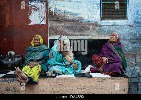 Portrait of three elderly women sitting in an alley. Jodhpur, Rajasthan, India Stock Photo