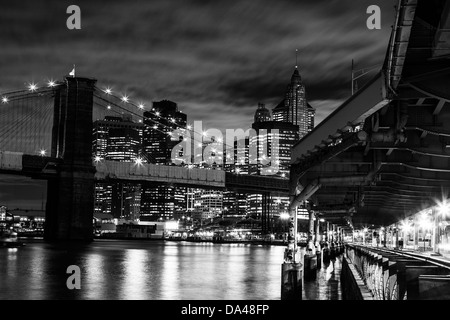 New York - night black and white view of Brooklyn Bridge and Manhattan