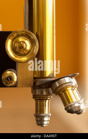 closeup of old microscope lenses or vintage scientific equipment Stock Photo