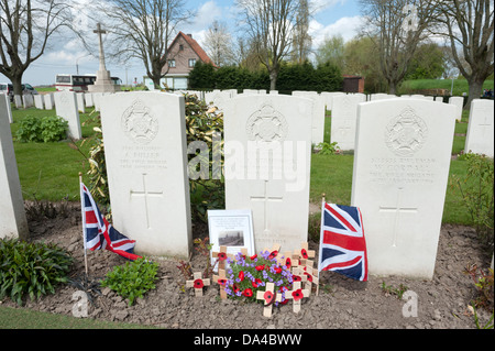 Essex Farm Commonwealth War Graves Cemetery, Ypres, Belgium. Showing grave of Rifleman Strudwick aged 15. Stock Photo