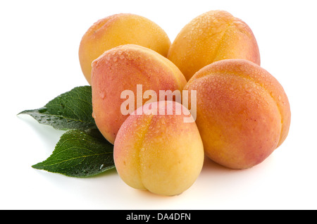 Sweet peaches with leafs on a white background Stock Photo
