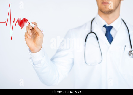 doctor drawing electrocardiogram on virtual screen Stock Photo