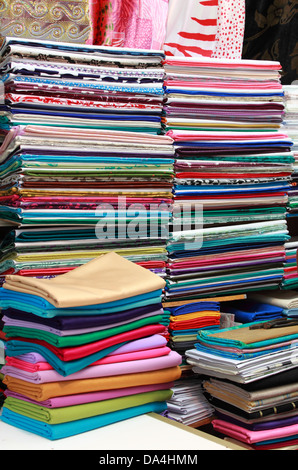Fabric store with stacks of colorful textiles Stock Photo