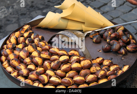 Grilled chestnuts for sale in a market stall Stock Photo