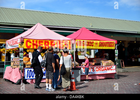 Fresh fruit sold in tent stands at the Pike's Place Public Market. Seattle, Washington, USA. Stock Photo