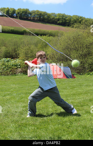 Boy about to hit a tennis ball Stock Photo