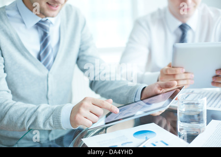 Close-up of businessmen using touchpads Stock Photo