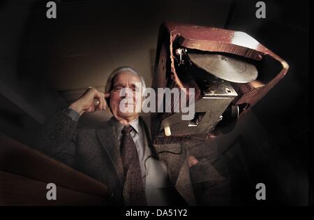 July 3, 2013 - FILE - DOUGLAS C. ENGELBART, one of the inventors of the computer mouse and a computer visionary, has died at the age of 88. PICTURED: July 8, 2004 - San Francisco, California, U.S - With his first prototype which was carved out of a wooden block, had wheels and a tiny red button. In 1970 he received a patent for the mouse pictured. (Credit Image: © Mark Richards/ZUMAPRESS.com) Stock Photo