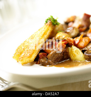 Beef bourguignon. a stew prepared with beef braised in red wine, traditionally red Burgundy. A classic French dish. Stock Photo