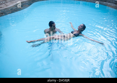 A young couple swimming. Stock Photo